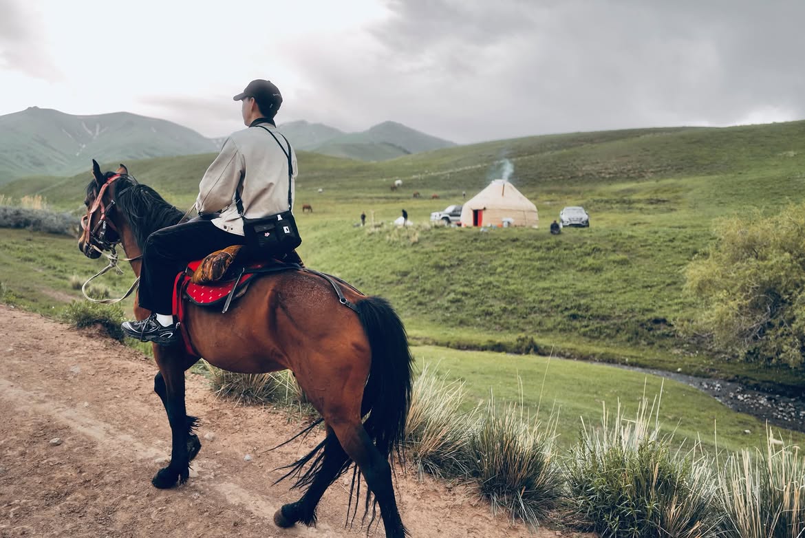 A rider arriving at a yurt camp in Kilemche Valley