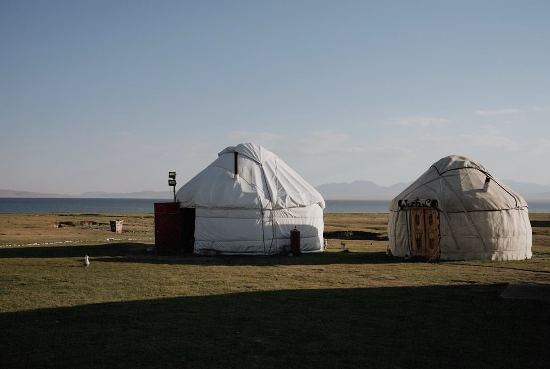 Yurts beside Song-Kol lake at sunset